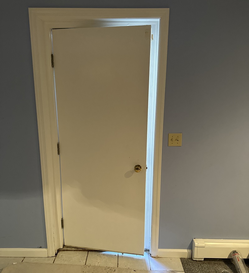 Steel basement door which leaks air
